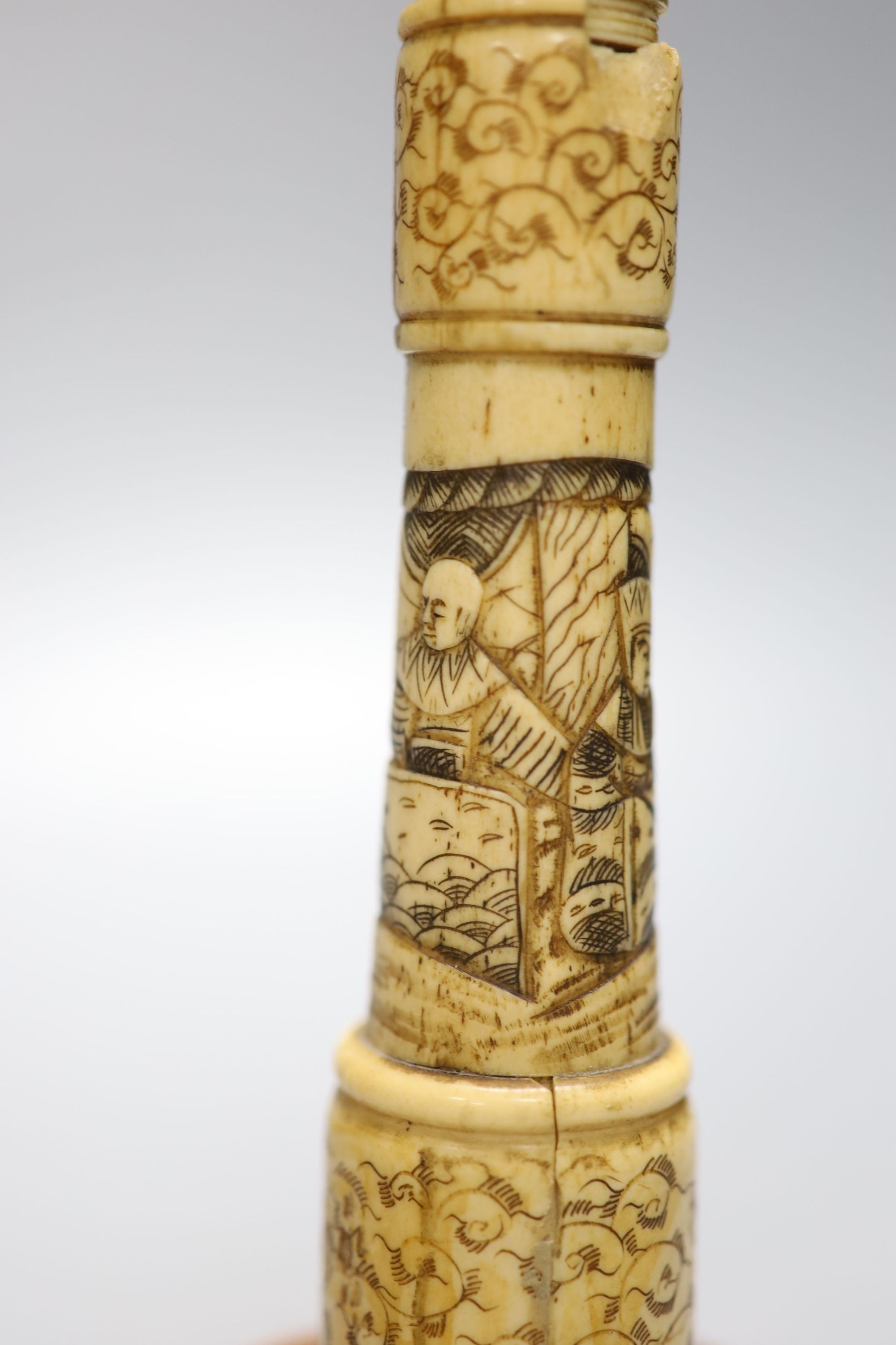 A pair of carved bone candlesticks, Meiji period, height 25cm